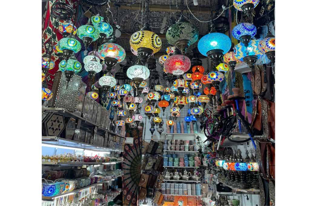 Brightly colored lamps in market stall