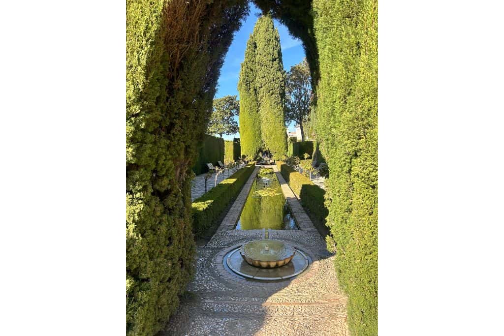Garden with fountain and sculpted hedge archway is a fun thing to do in Granda