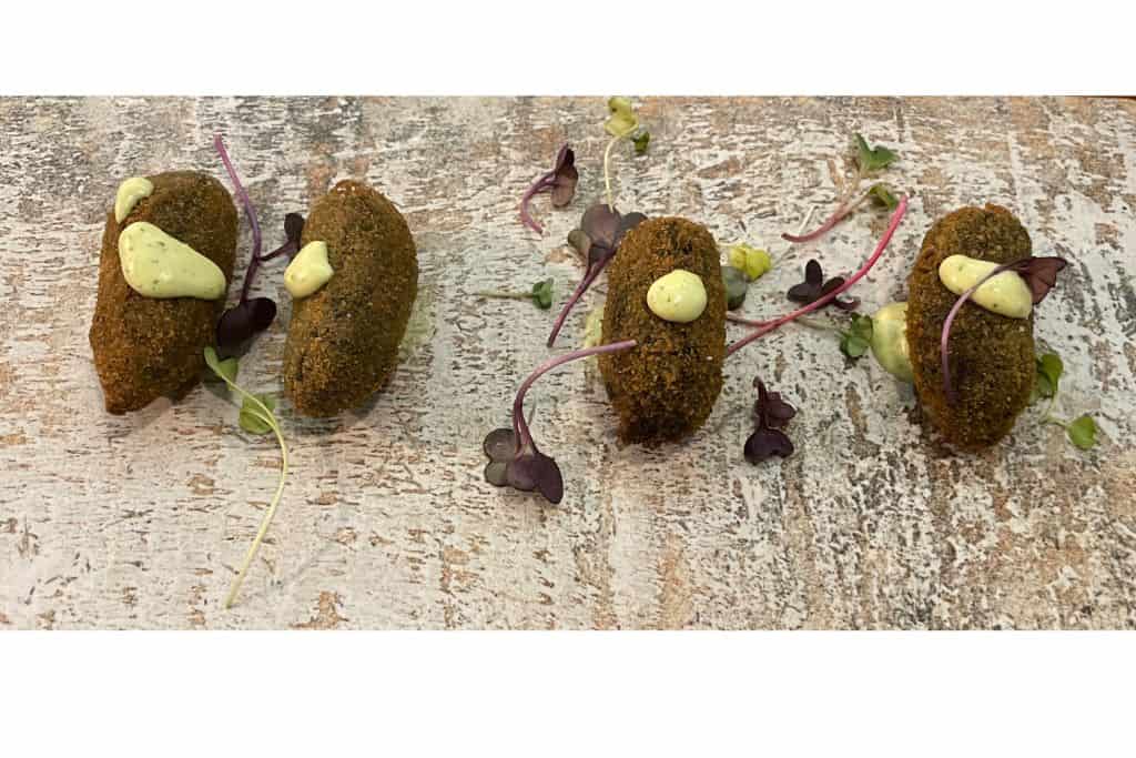 squid ink croquettes with micro greens