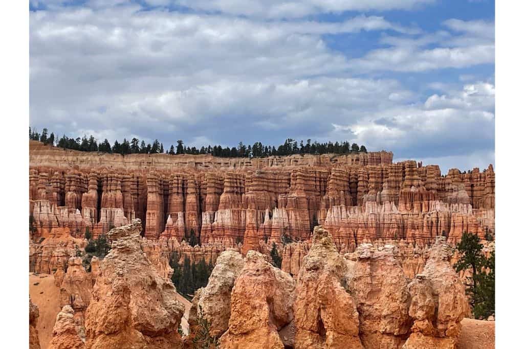 Blue sky with hoodoos below