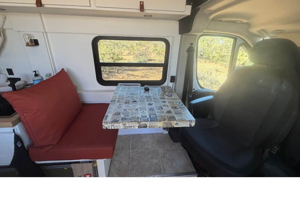 booth seat with newspaper table in van