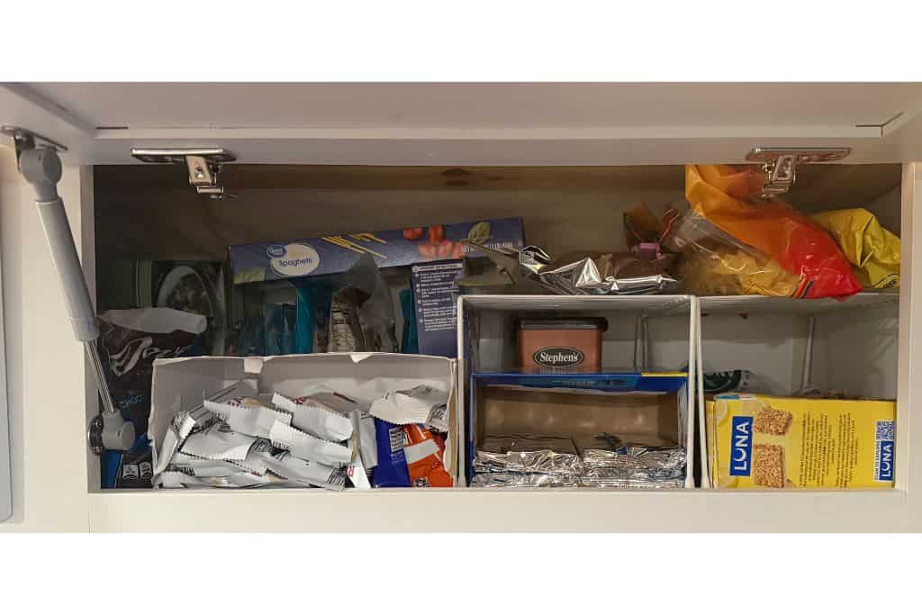 Food organized in van cupboard