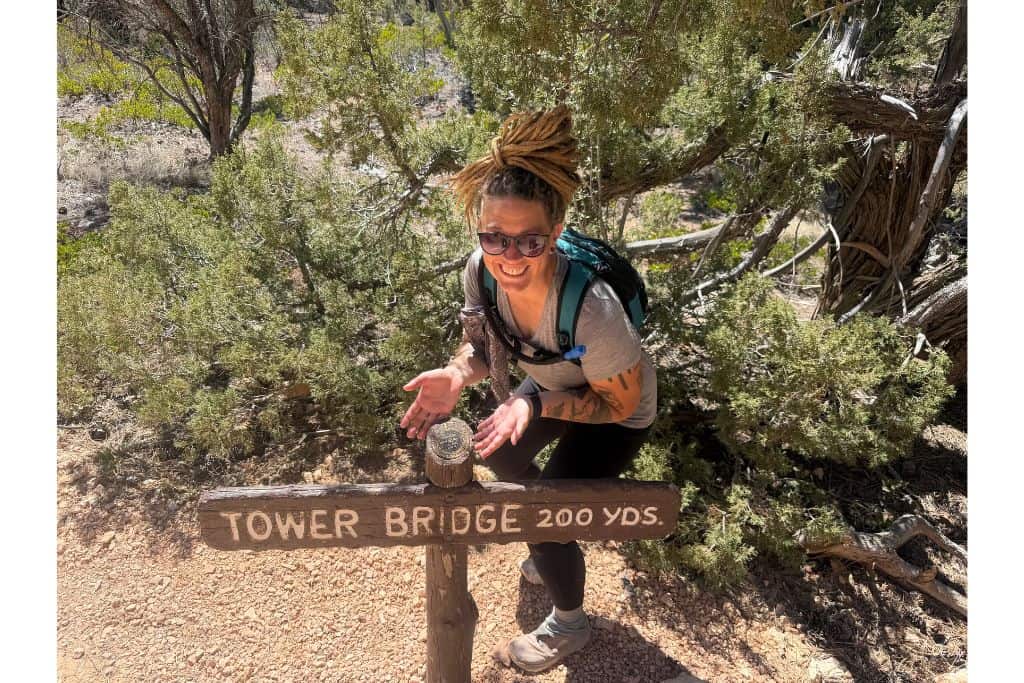 hiker with trail sign Bryce Canyon 