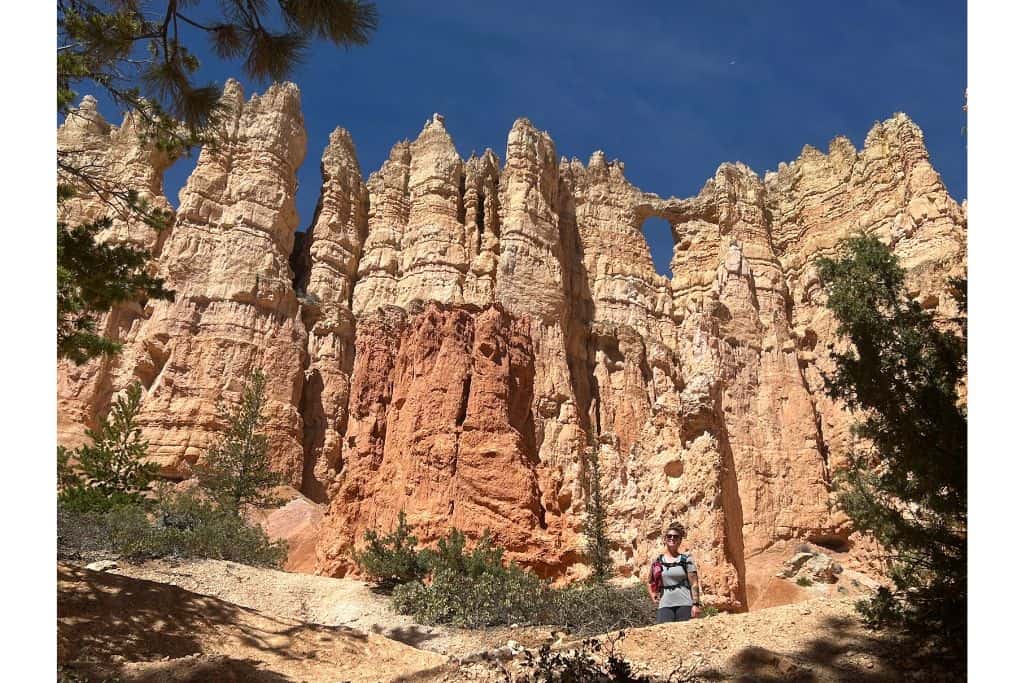 Hiker in front of the wall of windows, Bryce Canyon