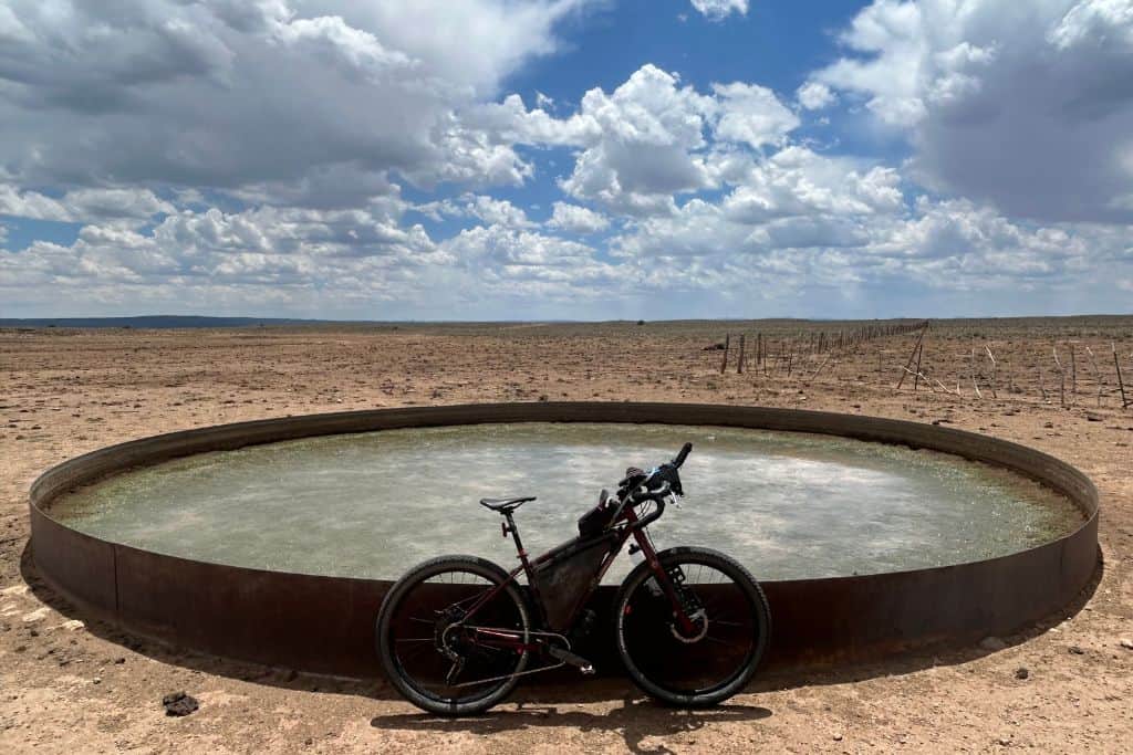 Bicycle leaning on cattle tank