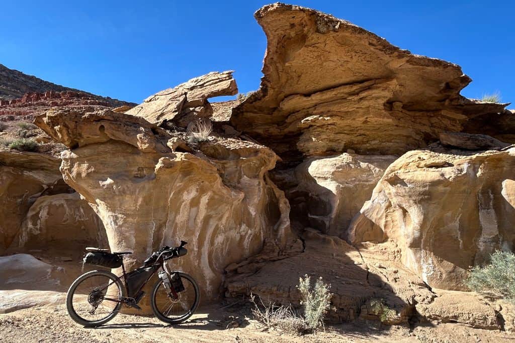 Bike loaded for overnight in front of rocks