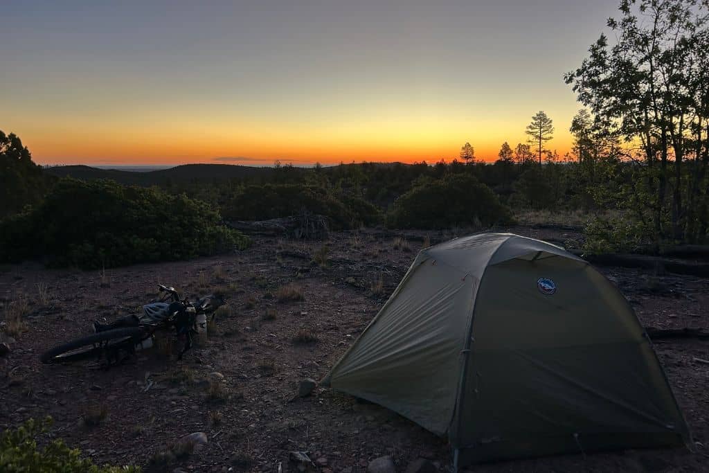 Tent and bike at sunset