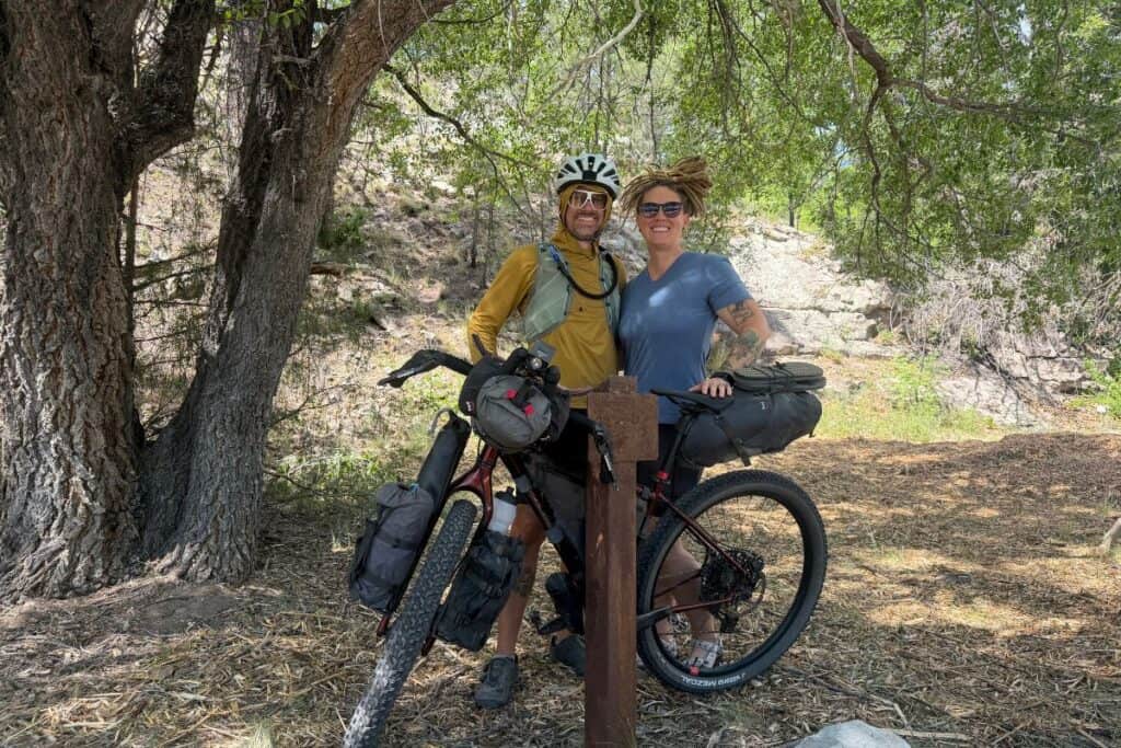 couple with loaded bikepacking rig