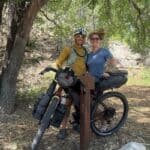 Couple standing with loaded bikepacking rig