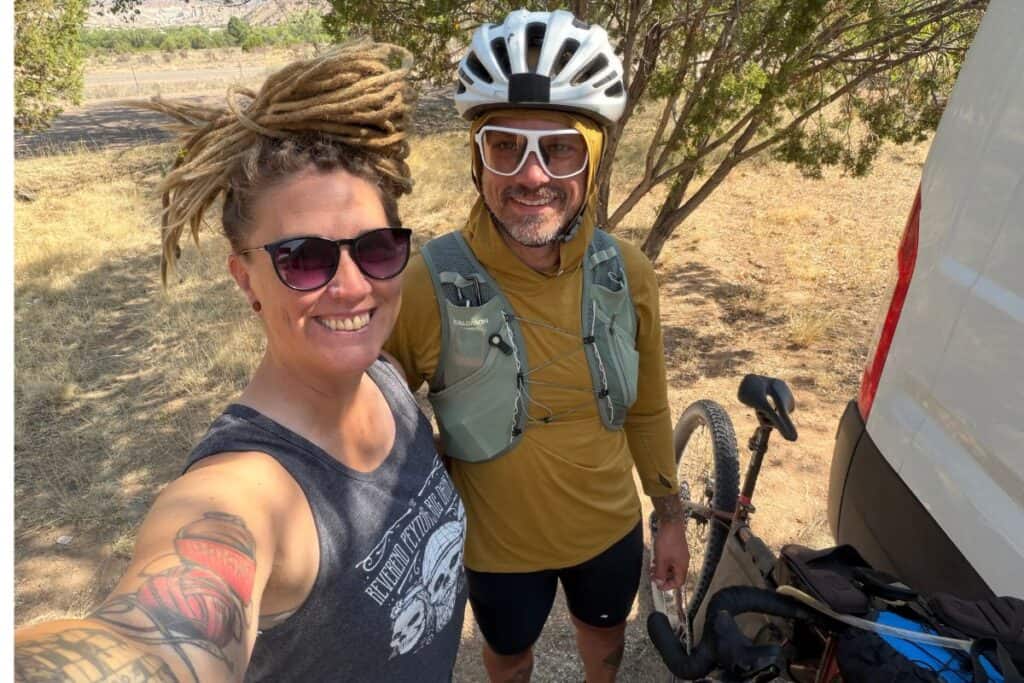 Couple ready for bike ride and support vehicle. 