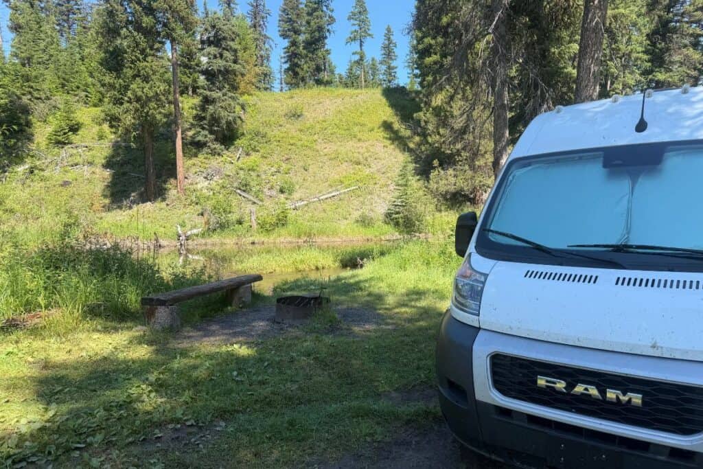 Camper van in campsite next to river