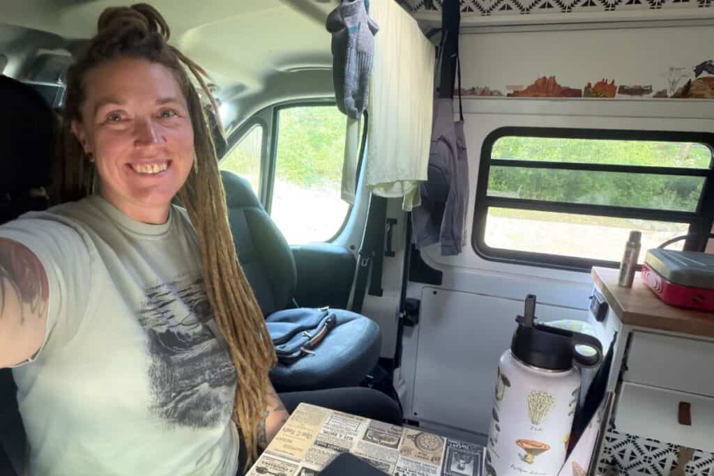 Woman in camper van at mobile command station
