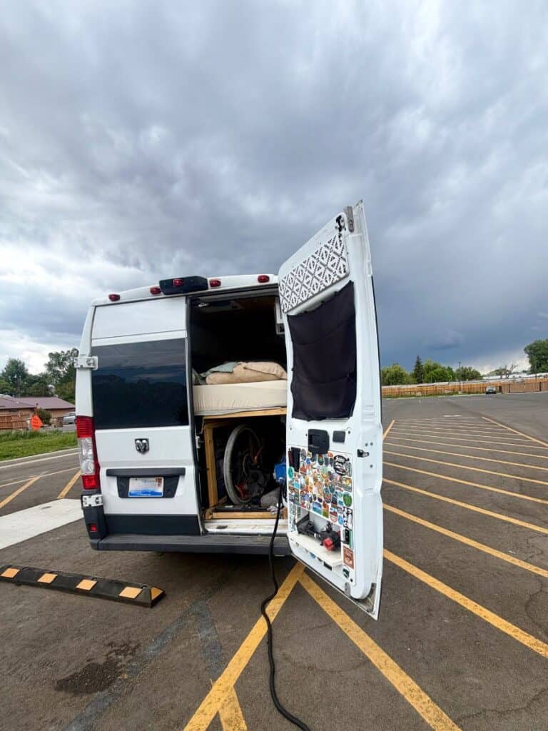 Camper van with hose, filling water tank